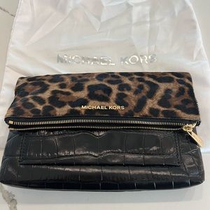 Black and Brown Michael Kors Handbag with gold chain strap.